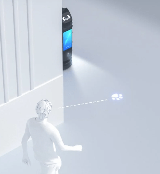 Ein Roboter blickt um eine Ecke auf eine Person und projiziert ein Licht mit Pfotenabdrücken auf den Boden.